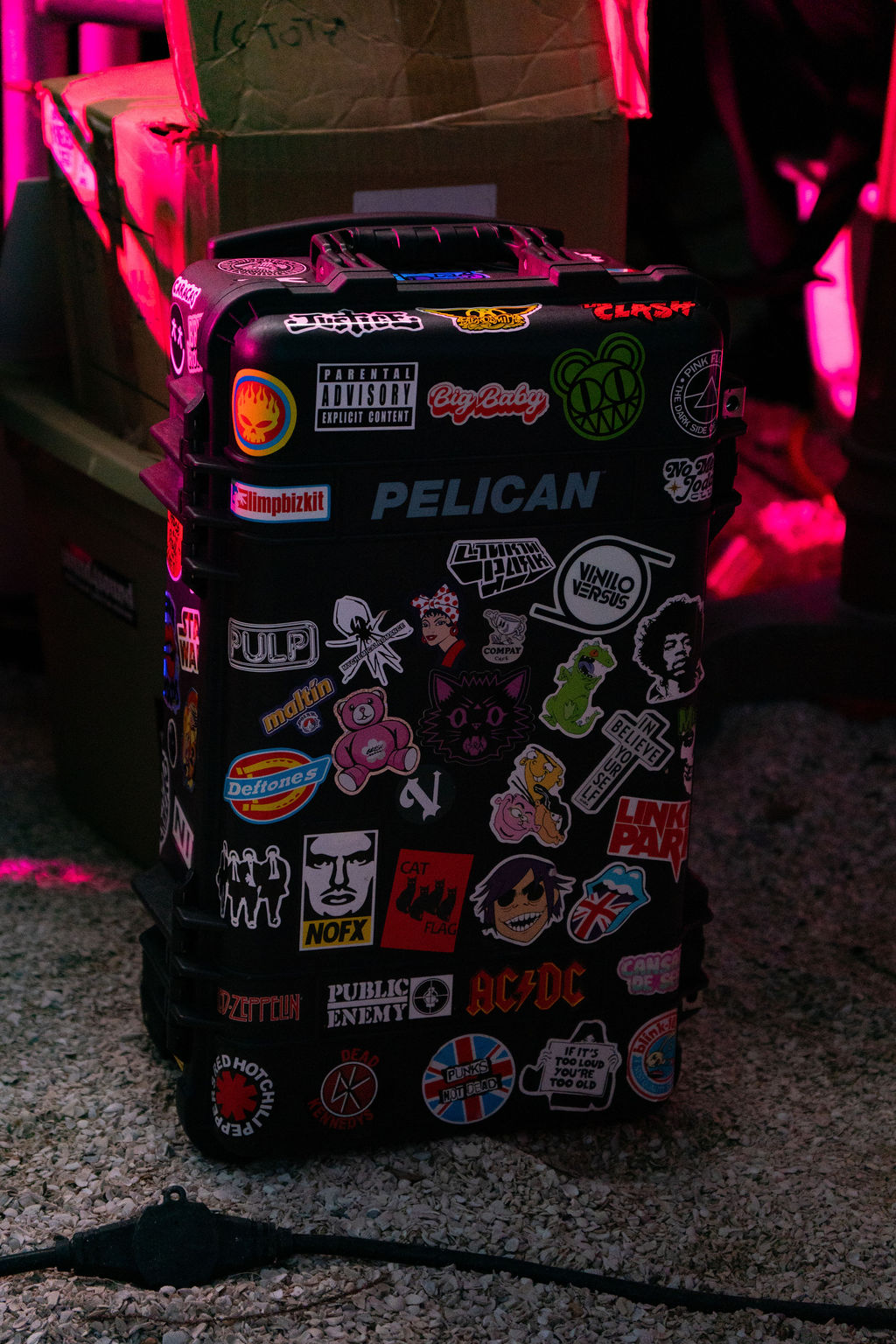 Sticker-covered road case backstage at Caracas at the Beach